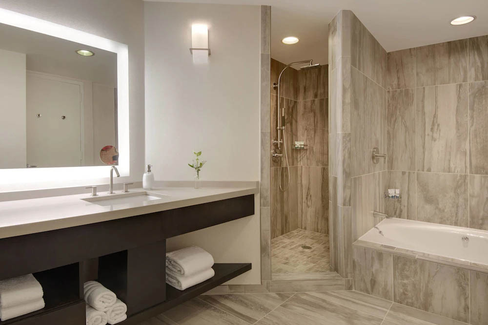 Bathroom with Heavenly Bath Shower System in walk-in shower unit at the Westin Park Central Hotel in Dallas 1000