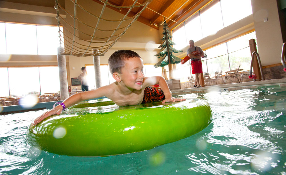 Hang from ropes and try to get across the floating obstacle course at Big Foot Pass