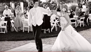 a bride and groom dancing during their outdoor reception at the inn on lake granbury
