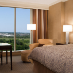 The Deluxe room has a king bed with beautiful views at the Omni Park West in Dallas