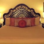 this king bed is beautifully appointed with pillows and makes a beautiful guestroom at the wildwood inn denton texas