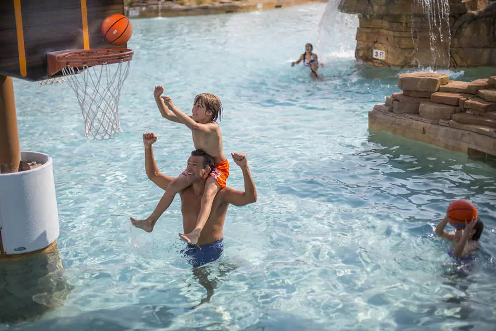 Pool with zero-entry and basketball at the Outdoor Water Park at Gaylord Texan Resort 1000
