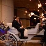 Bride and Groom ready for a horse and carriage ride for their getaway transporation after the wedding at the Omni Park West Dallas