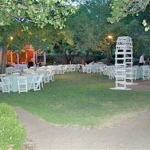 an outdoor wedding reception on the lawn of the lockheart gables bed and breakfast with shite tables and chairs