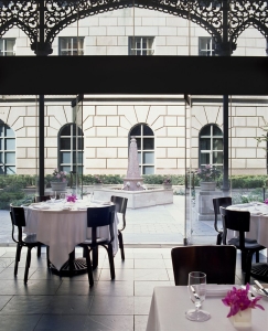 a beautiful restaurant inside the Rosewood Crescent Hotel overlooking the picturesque couryard