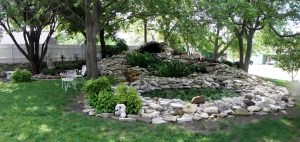 this water feature with big rocks can serve as a back drop during your outdoor wedding ceremony at the lockheart gables b&b