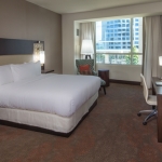 guest room with king bed at the Hilton Granite Park in Plano Tx