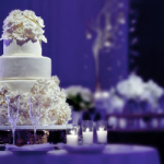 A beautiful white wedding cake at during a wedding reception at the Rosewood Crescent hotel in Dallas Tx